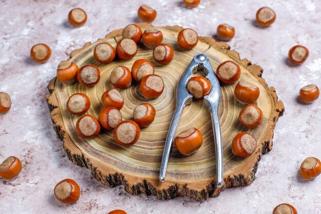 Hazelnuts on concrete background, top view