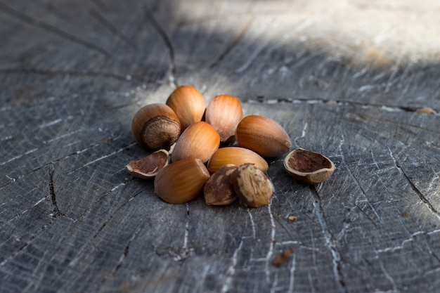 Hazelnuts, filbert on old wooden background