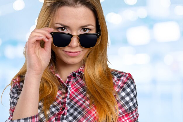 Head shot of woman wearing sunglasses