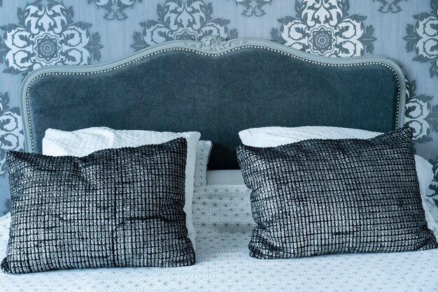 Headboard with pillow in a house bedroom