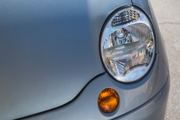 Headlight of blue auto