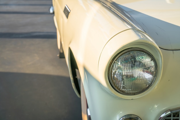 Free photo headlight of a vintage car . ( filtered image processed vintage