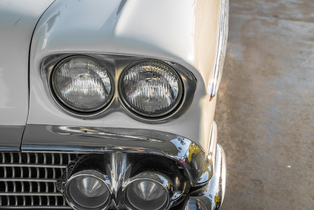 Headlight of a vintage car . ( Filtered image processed vintage