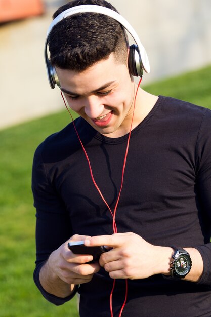 headphones boy playing people mobile phone