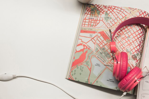 Headphones lying on map