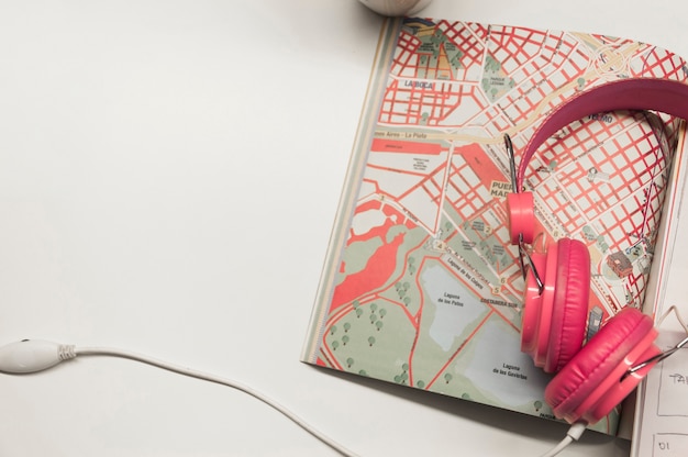 Headphones lying on map