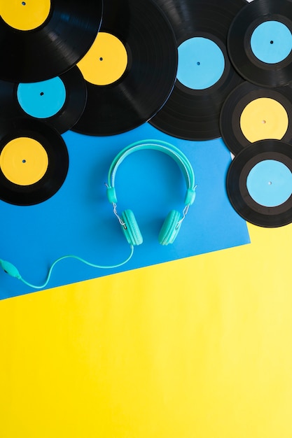 Headphones below various vinyls