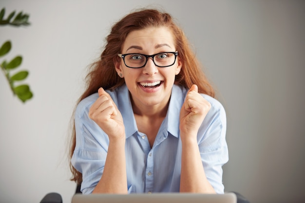 Free photo headshot of euphoric successful businesswoman