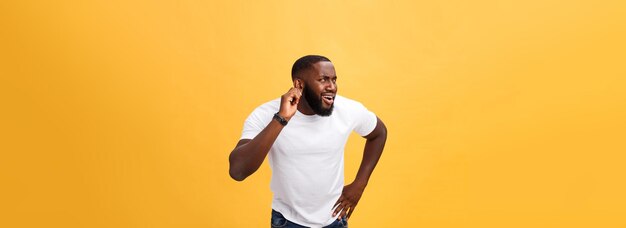 Headshot of goofy surprised bugeyed young darkskinned man student wearing casual white tshirt starin