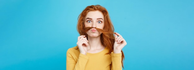 Free photo headshot portrait of happy ginger red hair girl imitating to be man with hair fake mustache pastel b