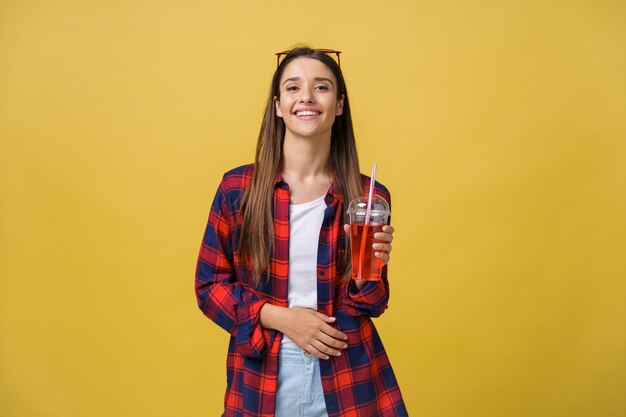 Headshot Portrait of happy girl with freckles smiling looking at camera Isolated over yellow background