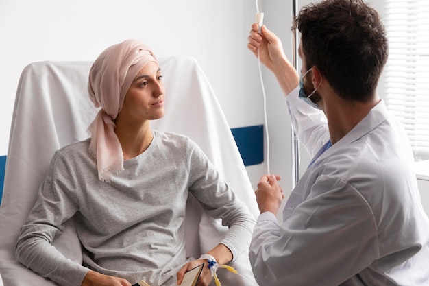 Health assistant taking care of a female patient