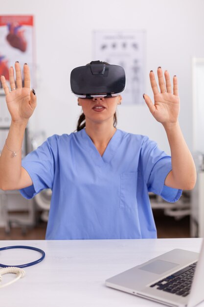 Health physician using medical inovation wearing virtual reality goggles in hospital office. Therapist using medical innovation equipment device glasses, future, medicine, physician, healthcare, profe