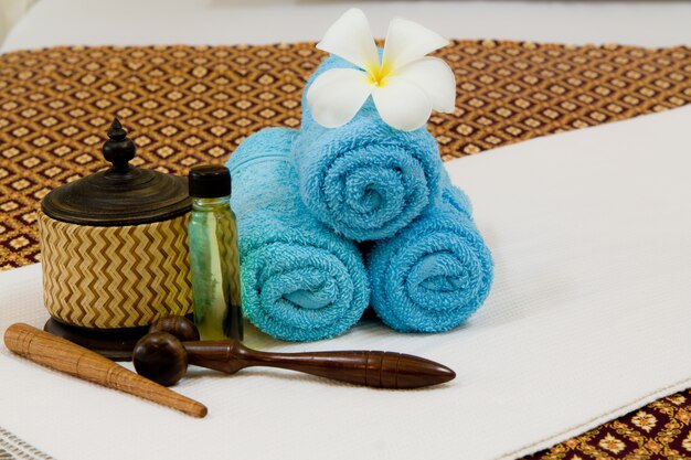 Health spa with white flower ,bottles with essential oil