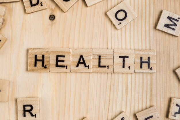 Health word on wooden tiles 