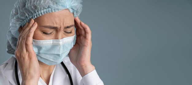 Health worker with medical mask and copy space