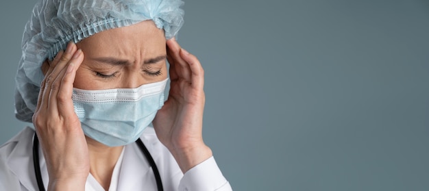 Health worker with medical mask and copy space