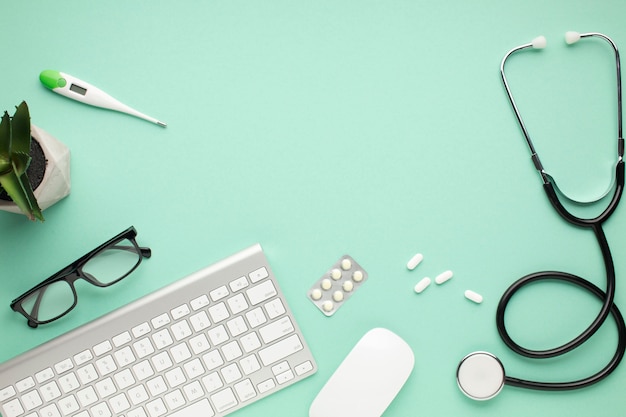 Healthcare accessories with modern devices on green background