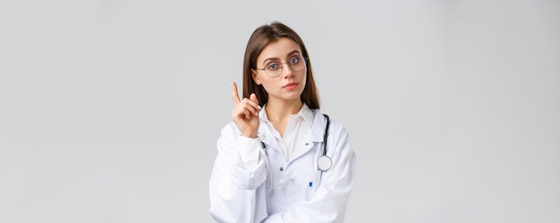 Healthcare workers medicine insurance and covid pandemic concept smart professional female doctor in