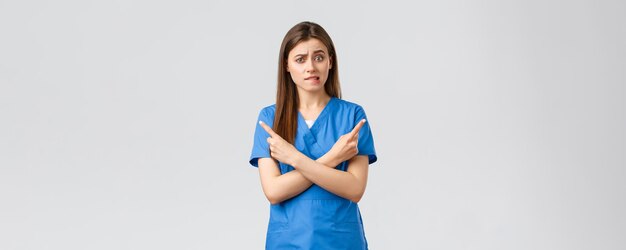 Healthcare workers prevent virus insurance and medicine concept indecisive and puzzled female nurse