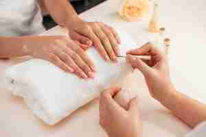 Free photo healthy beautiful manicure and manicurist