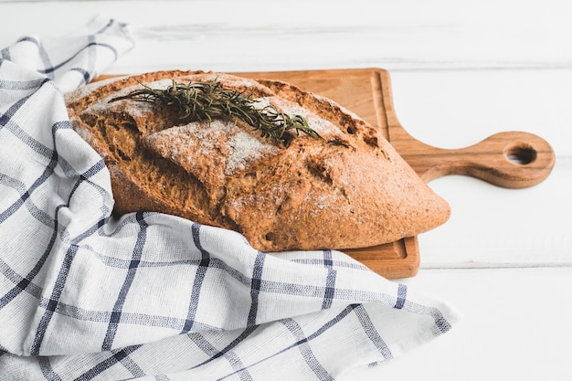 Healthy bread loaf with aromatic herb