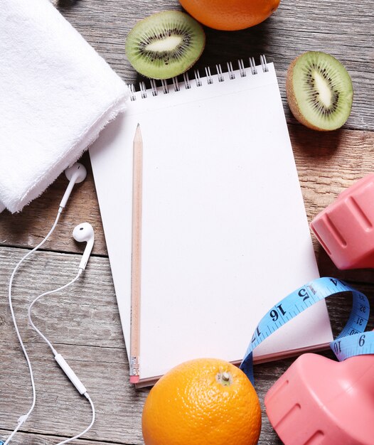 Healthy composition with fruits and notebook