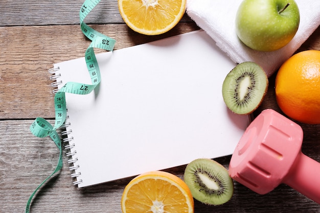 Healthy composition with fruits and notebook