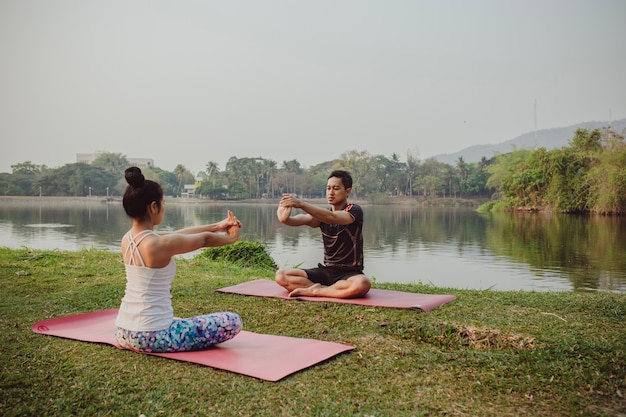 Healthy couple, yoga and nature
