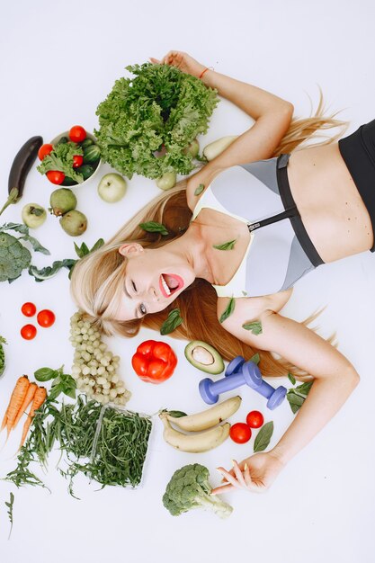 Healthy eating. Dieting and people concept. Blonde lying on the floor.