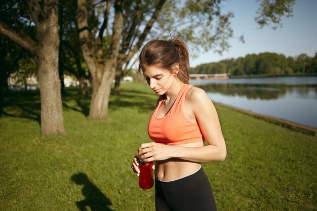 A healthy female is doing exercise outdoor