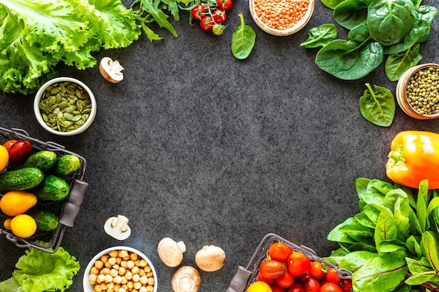 Healthy food background. autumn fresh vegetables on dark stone table with copy space, top view