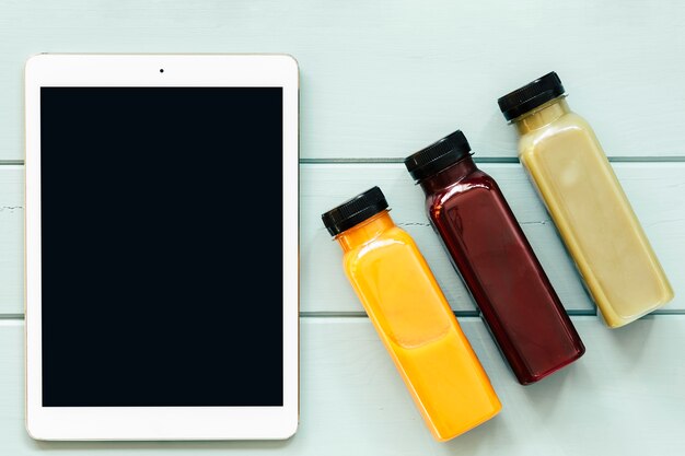 Healthy food concept with tablet and juices