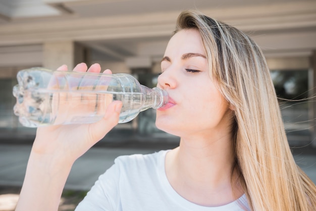 Healthy girl drinking water