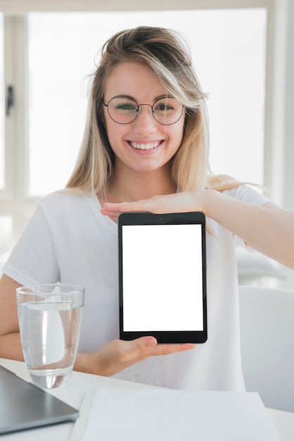 Free photo healthy girl showing tablet