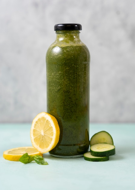 Healthy green drink with lemon and cucumbers
