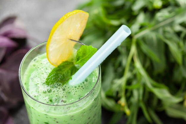 Healthy green vegetable smoothie with applesspinachcucumber