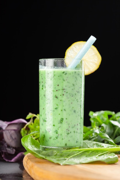 Healthy green vegetable smoothie with applesspinachcucumber