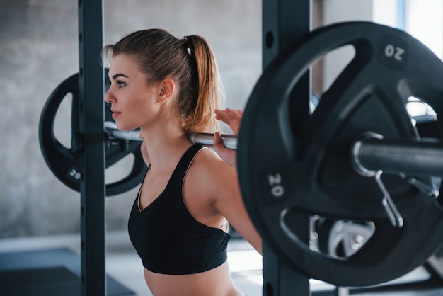 Healthy hobby. Photo of gorgeous blonde woman in the gym at her weekend time