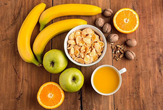 Healthy home made breakfast of muesli, apples, fresh fruits and walnuts