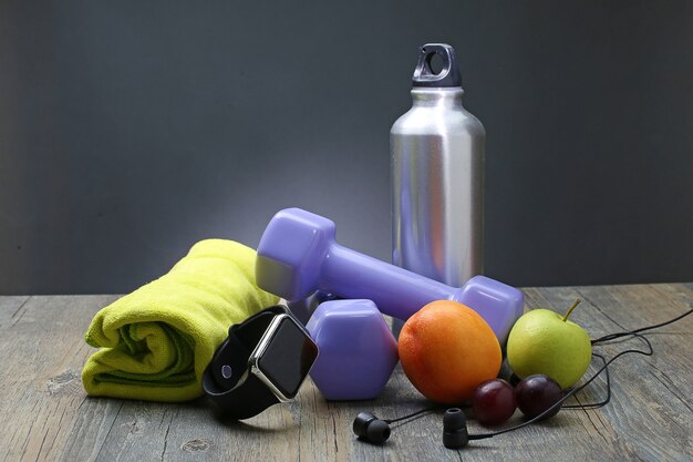 healthy lifestyle dumbbell smart watch and fruit