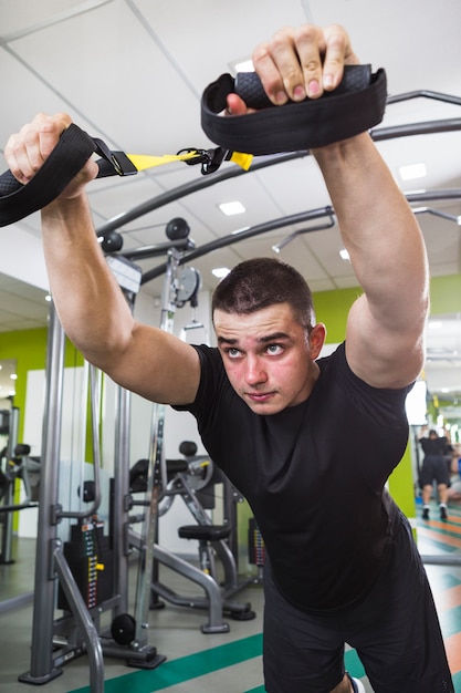 Healthy man training in the gym
