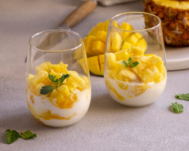 Healthy meal with yogurt and pineapple in glass