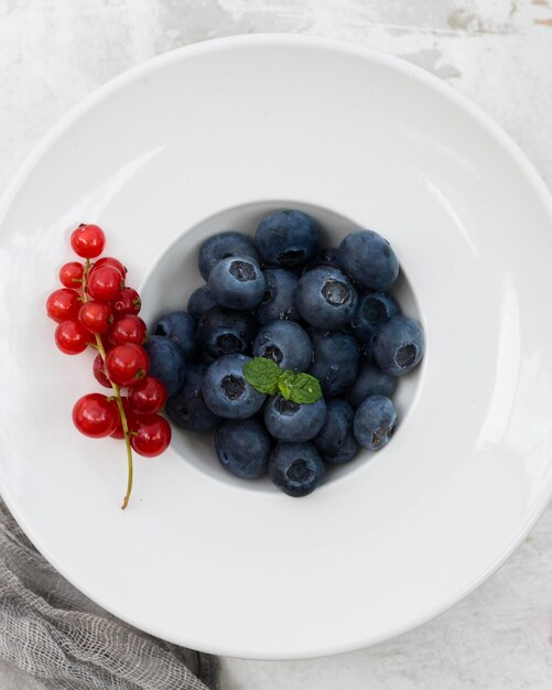 Healthy morning food cranberries and blueberries top view