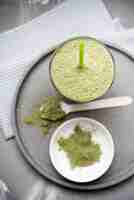 Free photo healthy organic green smoothie and powder