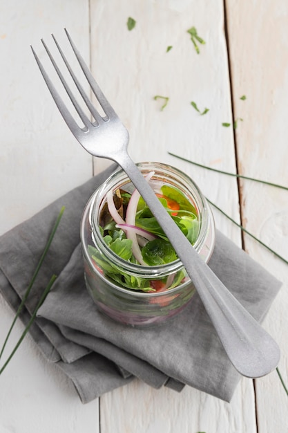 Free photo healthy salad in transparent jar composition