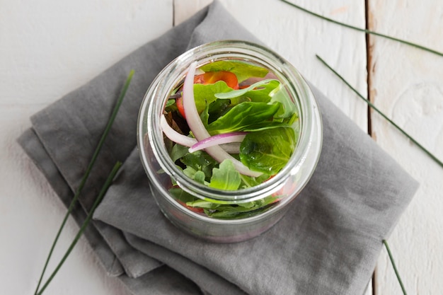 Healthy salad in transparent jar