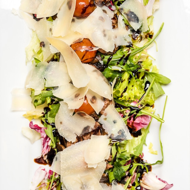 Healthy salad with cheese close up