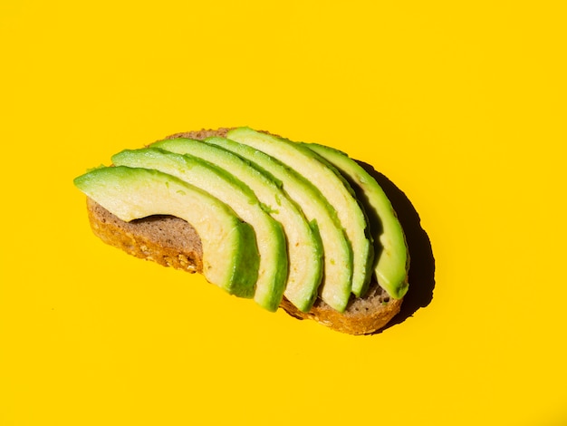 Healthy sliced avocado on a bread slice