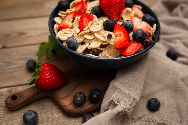 Healthy spelt breakfast with strawberries and blueberries